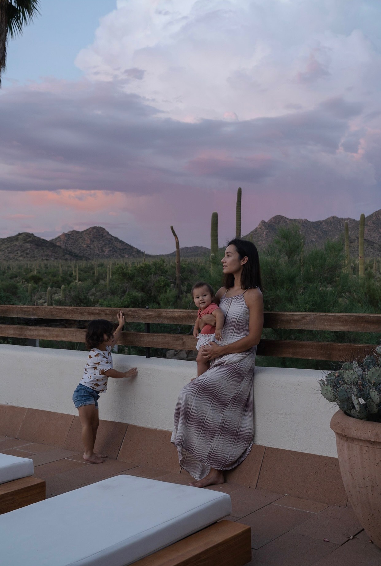 Mother and children watching desert sunset